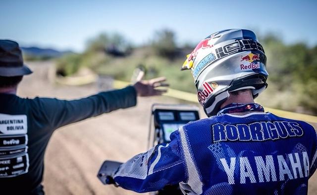 Arriving a little late to the winner's table, Team Yamaha claimed its first win at the ongoing Dakar Rally as Helder Rodrigues won the stage 12. But the low-point of the race was Sherco TVS rider Alain Duclos losing his helmet.