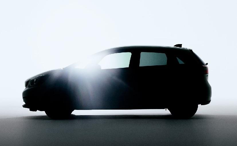 Honda has released a teaser image of one of the most significant debuts it will make at this month's Tokyo Motor Show. The image is of the upcoming next generation Honda Jazz and the company has not revealed much. It's more the car's silhouette than anything, but if you look closely, three things are very evident. The car appears to have a slightly lower profile with a longer wheelbase, and yet short overhangs. This tells you that while the cabin is likely more roomy, the overall length will probably still stay under 4 metres - crucial for us in the Indian context. The second is that the styling appears to move away from the last car's edgy straight lines and taller look to a more rounded and conventional proportion. The hood is longer and not as angled and the headlights are now more rounded and upswept - with a snub-nosed thick chrome grille, as seen in recent models like the Honda Civic and Honda CR-V. And thirdly, the car also seems to have cup shaped DRLs (daytime running lights) and a more horizontal and wrap-around style tail lamp cluster. And there's a shark fin antenna on the roof.