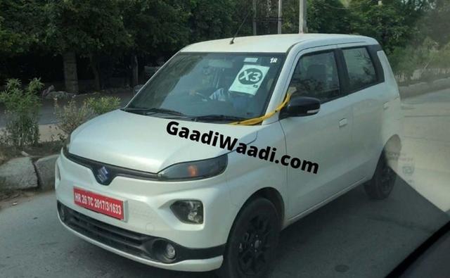 Unlike earlier spy photos of the car, which were seen with Toyota badged wheels, this new prototype comes with the Suzuki logo, indicating that the electric version of the Wagon R might after all be, a Maruti Suzuki product.