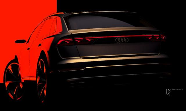 The teaser showcases the rear end of the facelifted Audi Q8 with revised styling for the taillights. 