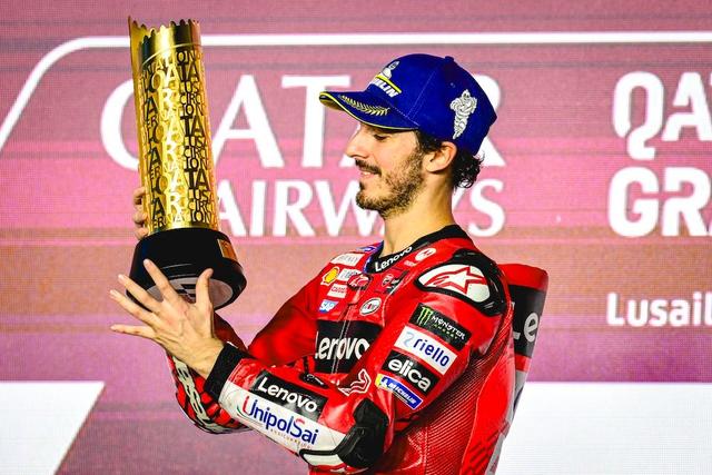 Bagnaia claimed victory at the 2024 Qatar Grand Prix, sharing the podium with Brad Binder in second place and Jorge Martin in third
