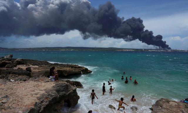 An inferno at Cuba's largest oil storage facility has killed at least one firefighter, injured many more, and threatens to further swell the fuel import bill for the impoverished island nation that relies on foreign oil for everything from transportation to its power grid.