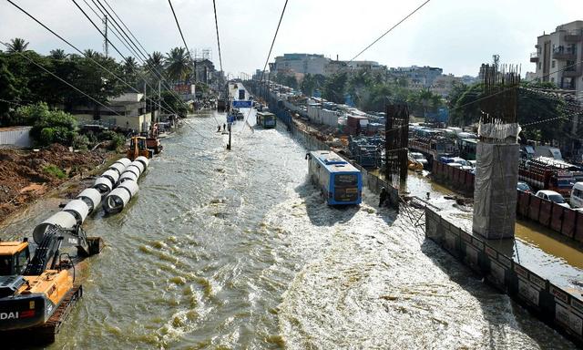 Large parts of India's tech capital Bengaluru were under water after torrential rains uprooted trees, caused crippling traffic and forced offices to issue work-from-home orders to employees, raising fears of further disruptions through the week.