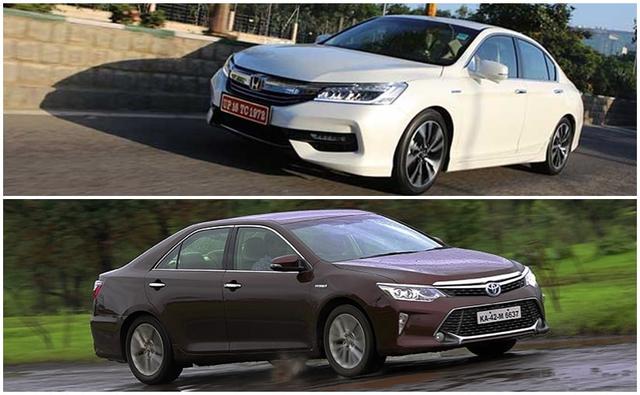 Honda is all set to re-launch the Accord sedan in India tomorrow that will compete with Toyota's Camry Hybrid sedan. While we will bring you the road test comparison soon, for now, let's see how the cars fare against each other on paper.