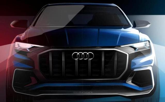Audi is all set to unveil the first-ever Q8 concept next month at the North American International Auto Show, in Detroit. While we still await more details about the upcoming Audi Q8 concept, the e-tron lettering seen on the front the car indicates that the Q8 will mostly likely be an all-electric vehicle.