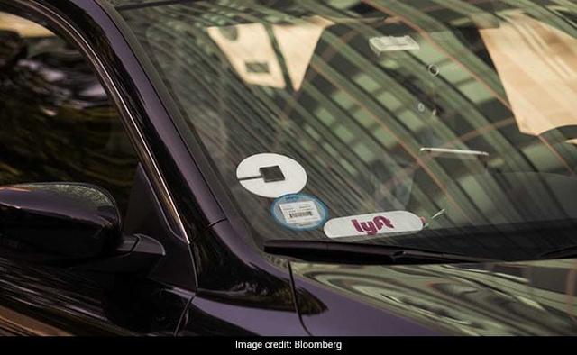 A group of investors led by SoftBank Group Corp and Toyota Motor Corp is in talks to invest $1 billion or more into Uber Technologies Inc's self-driving vehicle unit, which would value the unit at $5 billion to $10 billion, said two people familiar with the talks.