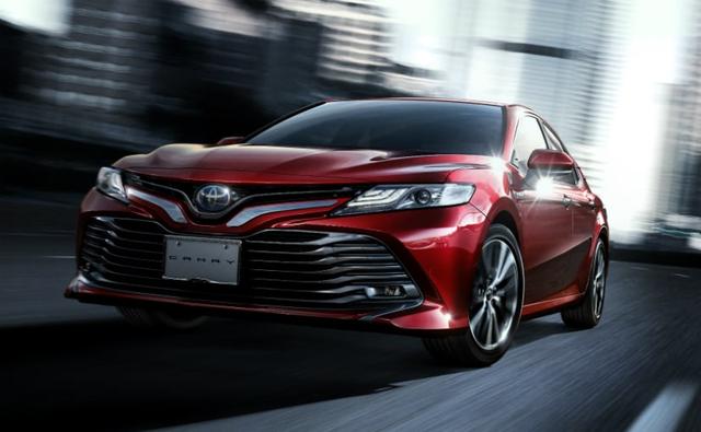 Toyota will launch the 8th generation of the Toyota Camry in India today, and the hybrid is all set to arrive  in India in an  all-new avatar. The new model is based on a sharper design language and is underpinned by the new TNGA platform shared with the Lexus ES300h. Under the hood, the 2019 Toyota Camry will continue using the 2.4-litre hybrid petrol that uses an electric motor as auxiliary and is likely to be mated to the same e-CVT gearbox as before. The new Camry  offers better driving dynamics, efficiency, and lower carbon emissions over its predecessor.