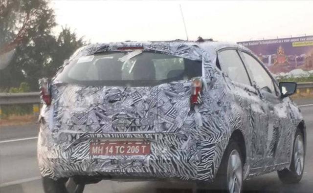 A near-production test mule of the upcoming Tata 45X (codename) has been spotted testing at the Mumbai-Pune Expressway. Some of the production-ready elements which are seen on the test mule include the taillamps and a new set of four-spoke alloy wheels which appear to be 16-inches. Tata Motors has also removed the camouflage from the rear windscreen and we can see adjustable headrests even for the rear seats. Moreover, right beneath the rising beltline, two distinctive profile lines are visible. One that starts from the fenders and runs across the haunches and then there is the second one which emerges from the rear door and merges into the C-Pillar.