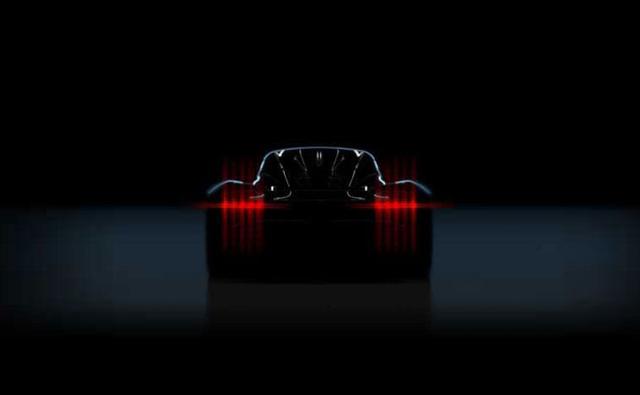 While Aston Martin is yet to finish work on the Valkyrie and Valkyrie AMR Pro, the company is already working on a new mid-engined hypercar and its dropped a new teaser of it making us want to see it in the flesh. Project 003, as its called, has its DNA deeply rooted in concepts and technology currently being developed for those road and track-only machines. Project '003' will be built around a lightweight structure and powered by a turbocharged petrol-electric hybrid engine.