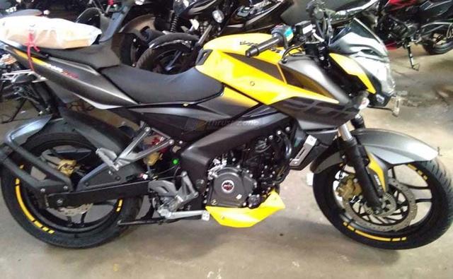 Bajaj Auto is all set to re-introduce the Pulsar NS200 in its signature yellow paint scheme. The Bajaj Pulsar NS200 was originally launched with the yellow paint job in 2012 but the same was discontinued over the years in India with the model having been discontinued briefly. The new paint scheme is likely to join the existing colour options - wild red, graphite black, and mirage white. The body graphics and the overall design remains unchanged though. The yellow Pulsar NS200 was spotted at what seems to be a dealer yard, hinting at an imminent launch.
