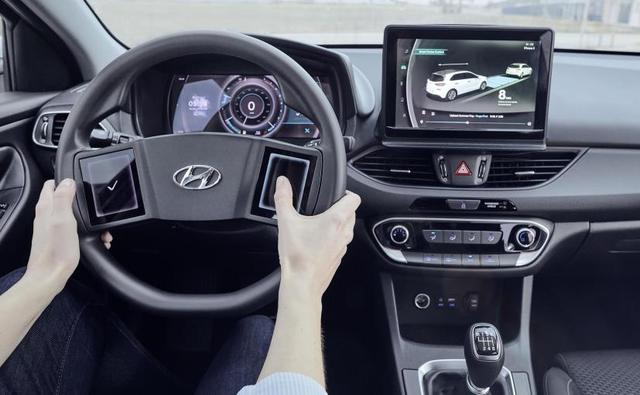 The Hyundai i30 with the new virtual cockpit comes with a new steering wheel that comes with wide bridges one either side to house the two vertical displays.