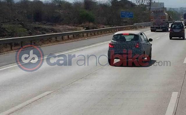 The Tata Tiago will get a mid-life update this year and a test mule has been spotted on the Mumbai-Pune Expressway. We already know that the new Tiago will get design updates similar to the Tata Altroz and will embody Tata's new IMPACT 2.0 design language. The changes will be made predominantly to its face while the rear will be updated modestly.