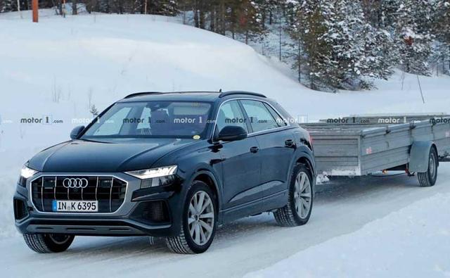 Audi has already shared plans about electrifying a host of its models including the A6 and A8 sedans. The company had also mentioned about introducing plug-in hybrids to the Q range and it looks like the recently unveiled Q8 coupe SUV will be the first electrified Q model. A test mule of the Q8 has been spotted testing and few elements are clear giveaways of it being the hybrid iteration.
