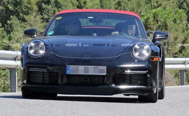 The next-generation Porsche 911 Turbo Cabriolet gets a new red soft top roof along with subtle changes in the design.