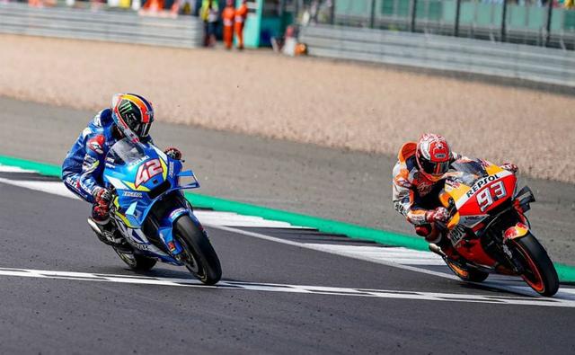 Alex Rins made a spectacular move in the final seconds of the 2019 MotoGP British Grand Prix to win one of the most thrilling races of the season. The Suzuki Ecstar rider passed reigning champion Marc Marquez just moments before the finish line to cross the chequered flag. The long duel between the riders saw Rins edge out past the final corner by a margin of 0.013s at the Silverstone circuit. This marks Rins second MotoGP victory ever after bagging his first in the Austin GP earlier this year, apart from a few podium finishes. Coming in third was Yamaha's Maverick Vinales, 0.620s behind the lead riders while teammate Valentino Rossi was a distant fourth.