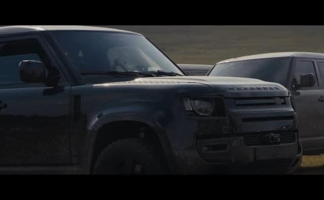 A new video released by Jaguar Land Rover reveals that the recently unveiled new-gen Land Rover Defender will be staring in the upcoming James Bond film - No Time To Die. The new behind the scene video, which appears to be of an elaborate chase stunt sequence in the wilderness, has several Defender SUVs being used for some off-road stunts, with professional stunt drivers behind the wheel.
