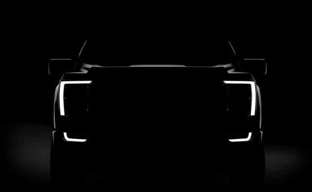 Ford Motor is all set to launch the much-awaited F-150 pickup truck on June 25, 2020. Ahead of its launch, the company has officially revealed the first glimpse of the upcoming 2021 F-150 pickup truck. The teaser image of the redesigned truck is not very revealing, as it provides a look at the silhouette, focusing more on the redesigned headlight cluster. It also hints the headlights will feature C-shaped LED DRLs that continues further down incorporating into the front bumper. The picture shows a new design signature of the pickup trucks that are quite popular in the US.
