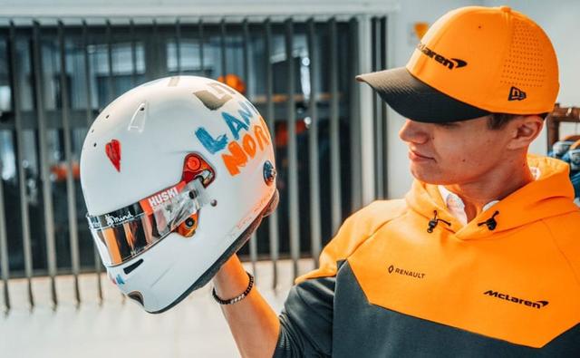 The design was submitted by six-year-old Eva Muttram as part of a competition, which the McLaren Racing driver will now wear in his home grand prix this weekend at the Silverstone Circuit.