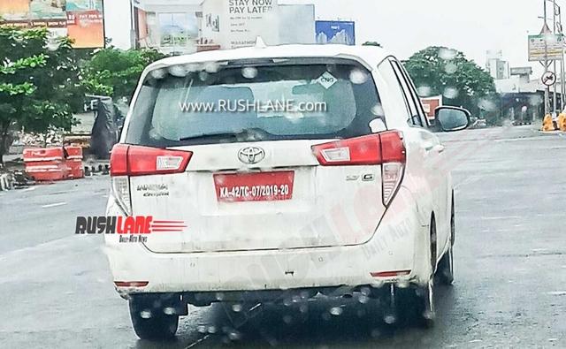 Toyota India is currently working on the CNG variant of its popular Innova Crysta MPV. A new spy image has surfaced online giving a glimpse of the test mule, which was spotted in a camouflaged avatar during a road test. Likely to be launched later this year, the CNG version of the Innova Crysta MPV could be offered on the lower variants of the model. The spy shot of the MPV suggests that the CNG test mule gets a 2.7 badging at the rear, hinting that it is powered by a petrol mill. Moreover, the sticker on the rear windshield hints confirming the test mule as a CNG iteration.