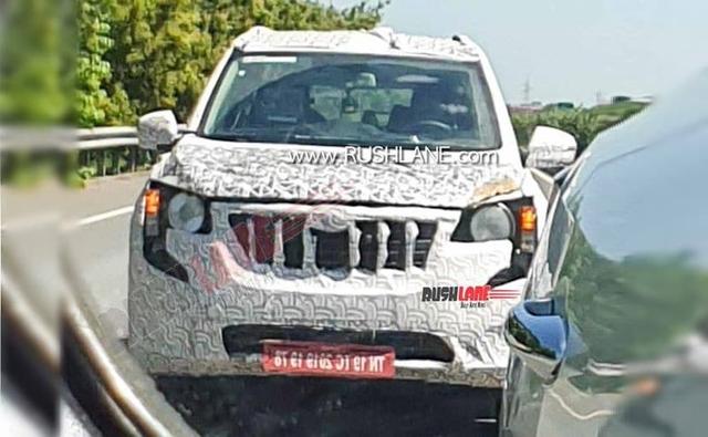 New spy photos of the next-generation Mahindra XUV500 have surfaced online, giving us a closer look at the SUV. Judging by the looks of it, the test mule in these new photos appears to be equipped with the production-spec grille, however, the rest of the SUV is still heavily camouflaged and it is wearing temporary parts, be it the headlamps, indicators or taillamps.