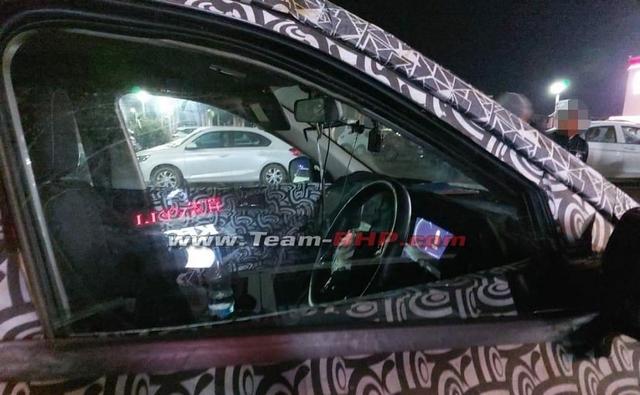 The upcoming next-generation Mahindra XUV500 has been spotted testing in India again, and this time around we get a glimpse of the SUV's new digital instrument cluster.