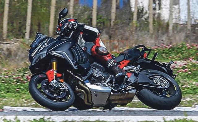 Latest spy shots show a new road-oriented Ducati Multistrada V4 Pikes Peak undergoing testing on a track.