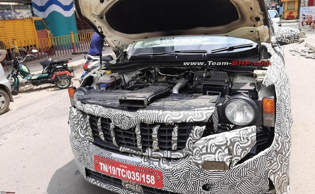 The upcoming Mahindra XUV700 was recently spotted testing in India again, and this time around we get to see the engine bay of the SUV.