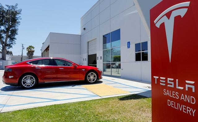 The officers are requesting damages of over $20 million from both the restaurant and Tesla.