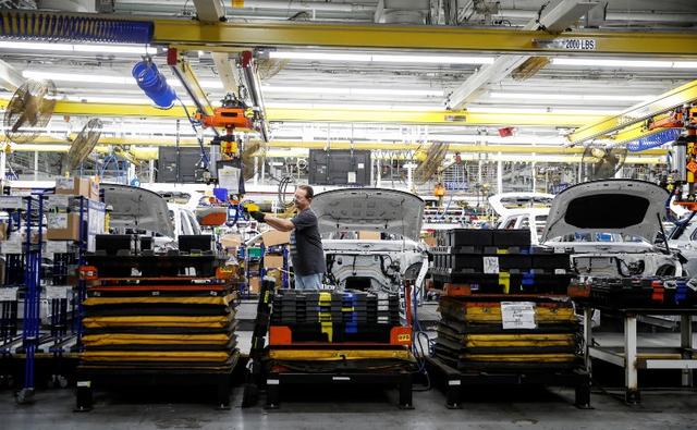 Manufacturing output dipped 0.1 per cent last month after accelerating 0.9 per cent in May, the Federal Reserve said.