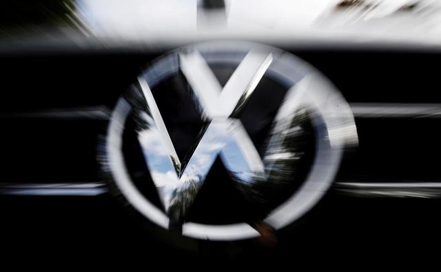 Volkswagen AG cut its outlook for deliveries, toned down sales expectations and warned of cost cuts as it reported lower-than-expected quarterly operating profit.