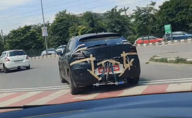 A test mule of the 2022 Maruti Suzuki Baleno facelift has been spotted testing in India. The prototype model was caught testing on the camera by a YouTuber, near Delhi/NCR, and the video posted by him hints that the updated Baleno will come with refreshed exterior styling and features.