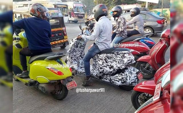 The camouflaged electric scooter is surrounded by the Bajaj Chetak but the test offering is distinctly different in appearance and resembles the Husqvarna Vektorr concept showcased earlier this year.