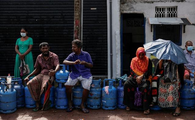 Long queues snaked around gas stations in Sri Lanka's commercial capital and its outskirts on Monday even though the island nation's government was scrambling to deliver fuel supplies and douse any unrest as it battles a devastating economic crisis.