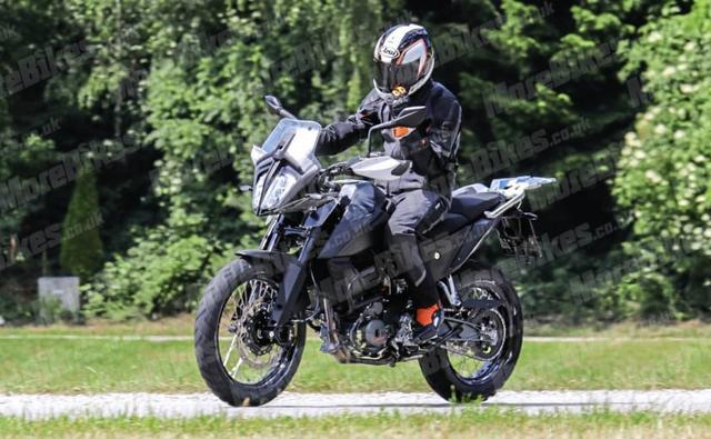 Some more images of the upcoming KTM 390 Adventure have emerged showcasing the pillion carrying capability of the bike.