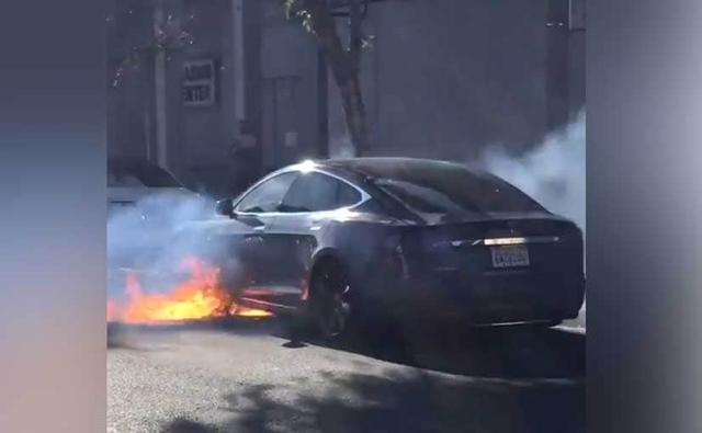 According to American actress Mary McCormack, her husband was flagged down by a couple who saw fire coming out of the Tesla Model S.