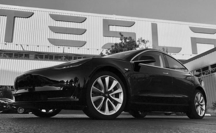 Elon Musk Showcases First Tesla Model 3 To Roll Off Production