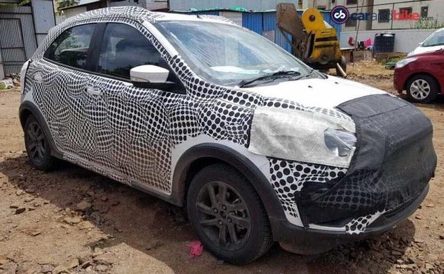 Though heavily camouflaged, we can see quite a few elements that are new up front and at the rear. The front bumper gets new lower air intakes and the headlamps too have been revised. The signature Ford grille remains but we get to see plastic cladding over the wheel arches, which is normally visible on 'Crossover' variants.