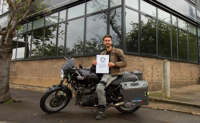 The 24-year-old motorcyclist rode through storms and across deserts to become the youngest person to circumnavigate the world solo by motorcycle, according to Guinness World Records.