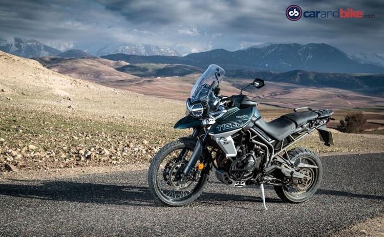 Triumph Motorcycles India will be adding the new top-of-the-line off-road variant to the Tiger 800 tomorrow. The current generation Triumph Tiger 800 was launched in India in 2018, albeit only with the XCx trim and more than 200 updates over its predecessor. The Triumph Tiger 800 XCa has been teased online and packs in more off-road tech and capabilities over the XCx version. The Tiger 800 XCa brings features like LED-equipped lighting, backlit illumination to the switch cubes and 5-way joystick, heated grips and seat, and aluminium radiator guard.