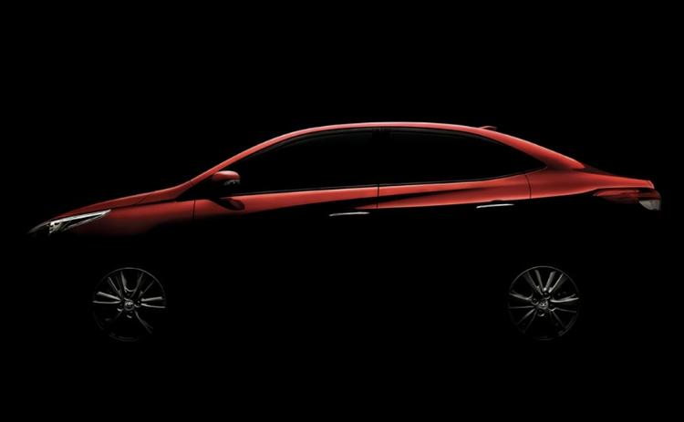 With the 2018 Indian Auto Expo just days away, Toyota has officially teased the upcoming Yaris compact sedan on its official website. The new Yaris sedan has been expected for years (under the Vios name) and is expected to be quite the volume player for the brand considering the fact that it will take on the likes of the Honda City, the Hyundai Verna and of course the Maruti Suzuki Ciaz. In the teaser that Toyota has put out, the Yaris sedan is seen wearing its top of the line package with a set of 6-spoke alloy wheels and by the looks of it, a set of chrome lined door handles.