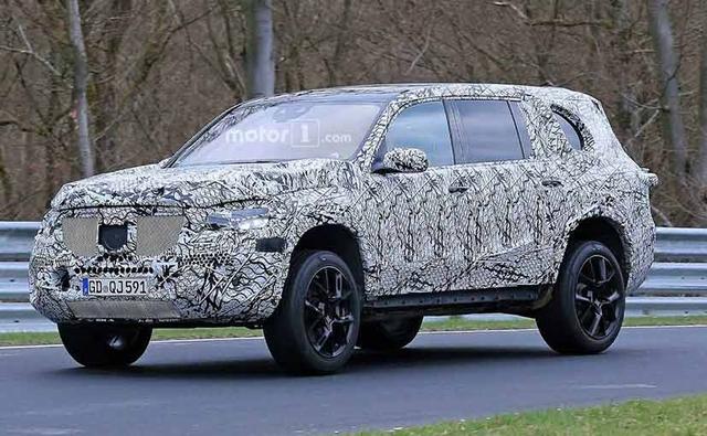 The flagship SUV from the Stuttgart-based carmaker is expect to make it public debut sometime next year, but right now, it is still in its initial development stages as the latest spy shots reveal very little of the SUV apart from the fact that it has definitely increased in its dimensions.
