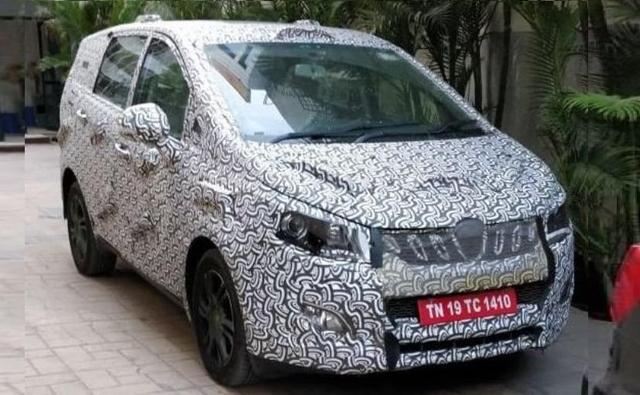 Mahindra's upcoming flagship MPV, codenamed U321, has been spotted yet again. Though fully camouflaged, this time around the prototype model was seen up and close, giving us a clearer look at the new production parts, which we have already seen in few earlier spy shots.