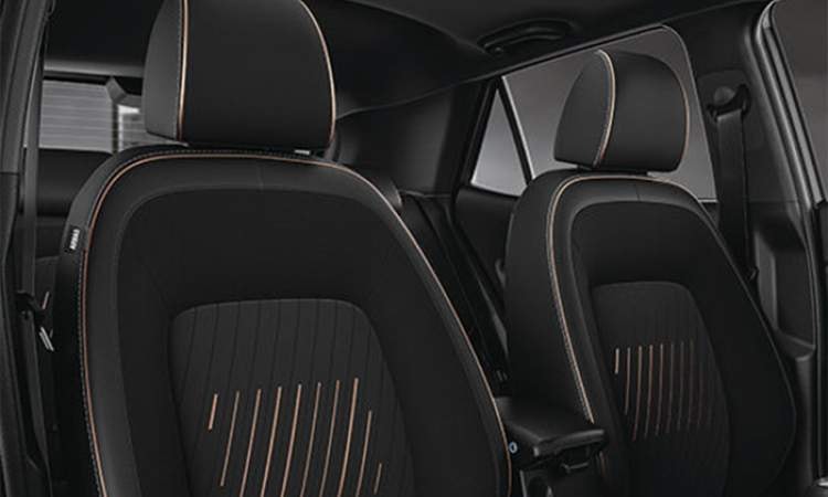 Exclusive black seat upholstery with brass coloured highlights Exclusive black seat upholstery with brass coloured highlights