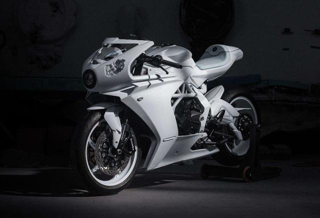 The motorcycle, finished in white, features unique mineral erosion artwork by Daniel Arsham on various body panels.