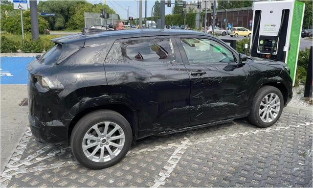 Caught on test in Poland, the production version of the EVX has a twin-screen layout on the inside; expected to have a range of over 500 km.