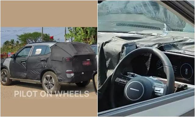 The spy shots revealed the interior with the new Hyundai logo on the steering wheel used by the automaker for its EVs globally. 