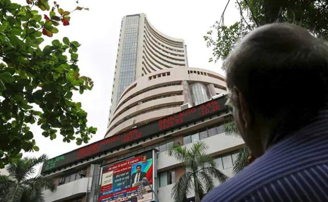 Indian shares closed at a near four-month high on Monday, led by metals and automobile stocks, as cooling oil prices and strong buying from foreign investors lifted sentiment.