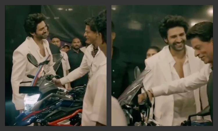 The viral video shows Shah Rukh Khan chatting up with Kartik Aryan with the Honda CB500X at the centre of their attention.