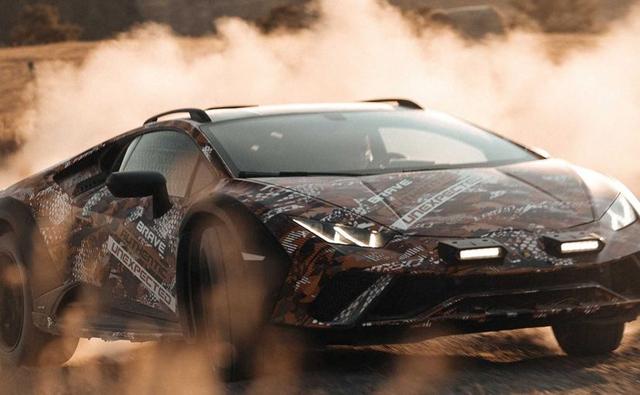 Lamborghini has dropped the first teaser of the Huracan Sterrato and unlike other Huracans, the Sterrato will feature roof rails and a generous ground clearance to tackle bumpy roads, while it's hard to miss the plastic body cladding tacked onto the fenders.
