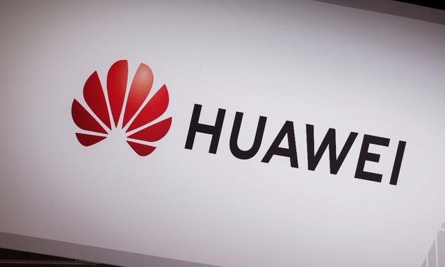  Huawei Technologies said its first-half net profit more than halved as a difficult economy curtailed demand from customers, compounding woes brought by U.S. technology restrictions.